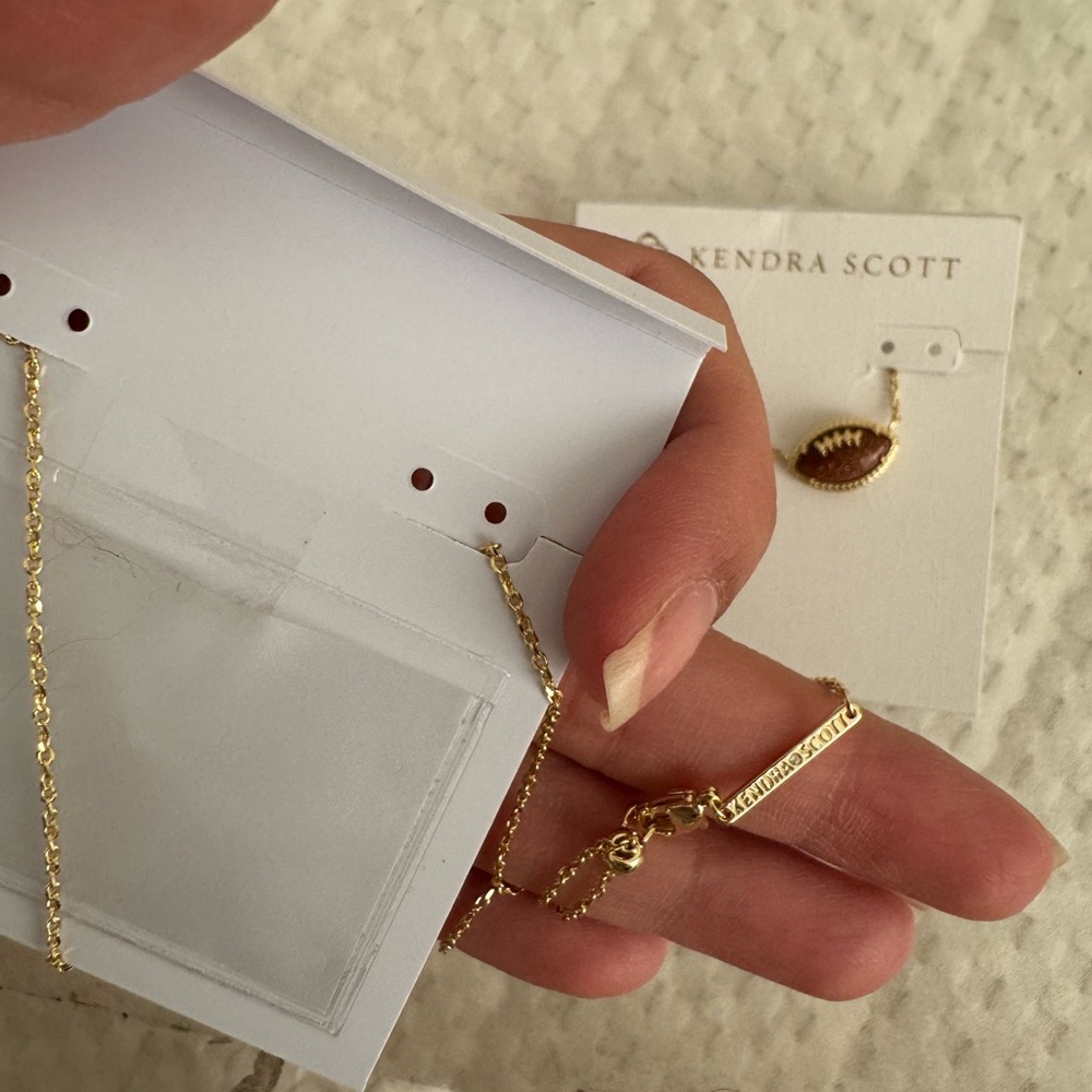 Kendra Scott 14k Plated Gold and Orange Sandstone Football Pendant Necklace - Picture 5 of 13